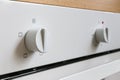 White electric oven switches. Control knobs for modern kitchen appliances Royalty Free Stock Photo