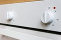 White electric oven switches. Control knobs for modern kitchen appliances Royalty Free Stock Photo