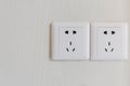 white electric plugs or outlet on wall Royalty Free Stock Photo