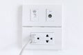 White electric plugs on wall background,White outlet interior, interior electric outlet in home,Socket electricity interior. Royalty Free Stock Photo