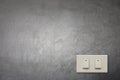 White electric switch on cement wall. Royalty Free Stock Photo