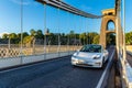 White electric Tesla car at Clifton Suspension Bridge in Bristol, UK Royalty Free Stock Photo