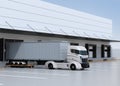 White electric truck parking in front of modern logistics center