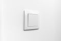 White electrical light switch on a white painted wall Royalty Free Stock Photo