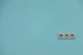 white electrical outlet on a blue wall, background Royalty Free Stock Photo