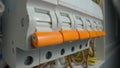 White electrical panel with many wires, electrical parts, automatic switches, breakers, residual current devices, fuses