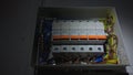 White electrical panel with many wires, electrical parts, automatic switches, breakers, residual current devices, fuses