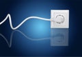 White electrical plug in the electric socket on a Royalty Free Stock Photo