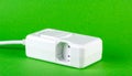 White Electrical Power Switch on a Green Background Royalty Free Stock Photo