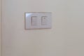 White electrical switch plate on the wall for control the light turning on or off Royalty Free Stock Photo