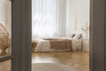 White elegant bedroom designed with natural materials