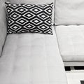 White elegant sofa with decorative cushion
