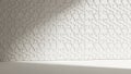 White Embossed Geometric Pattern on Wall with Soft Shadow and Floor image photo Royalty Free Stock Photo