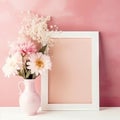 White empty blank photoframe with copy space for text or picture standing on table near vase with pink delicate