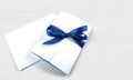 White empty cards with blue ribbon isolated on Royalty Free Stock Photo