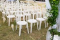 White empty chairs on lawn ready for secular wedding ceremony Royalty Free Stock Photo