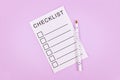 White empty checklist with pencil on violet background