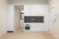 White empty classic kitchen in front view in new or refurbished apartment Royalty Free Stock Photo