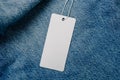 White empty clothing tag, label blank mockup for design on a jeans Royalty Free Stock Photo