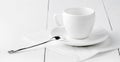 White empty coffee house cup with spoon and saucer Royalty Free Stock Photo