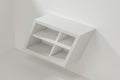 White empty cube shelf in the empty room, 3d rendering