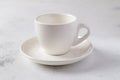 White empty cup for coffee on a plate isolated Royalty Free Stock Photo
