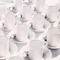 White empty cups arranged on the table