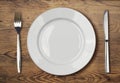White empty dinner plate setting on wooden table Royalty Free Stock Photo