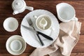 White empty dishes on wooden table with copy space Royalty Free Stock Photo