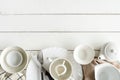 White empty dishes on wooden table with copy space Royalty Free Stock Photo