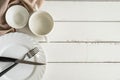 White empty dishes on wooden table with copy space Royalty Free Stock Photo