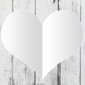 White empty heart shape on a light distress wood background