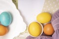 White empty list on Easter background with colored eggs set