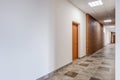 white empty long corridor with red brick walls in interior of modern apartments, office or clinic Royalty Free Stock Photo