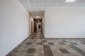 white empty long corridor with red brick walls in interior of modern apartments, office or clinic Royalty Free Stock Photo