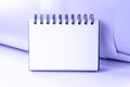 White empty office copybook with spiral mock up for notes and messages on trendy Very Peri color background. Blank open notepad Royalty Free Stock Photo