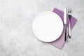 White empty plate, fork, knife and napkin Royalty Free Stock Photo
