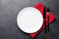 White empty plate, fork, knife and napkin Royalty Free Stock Photo