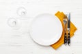 White empty plate, fork, knife and napkin Royalty Free Stock Photo