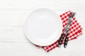 White empty plate, fork, knife and napkin Royalty Free Stock Photo