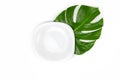 White empty plate on a white isolated background. Monstera sheet. Concept - diet, a small amount of food, weight loss