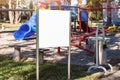 White empty poster with mockup place stands on children playground Royalty Free Stock Photo