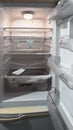 A white, empty refrigerator where a mouse hung itself. Royalty Free Stock Photo