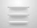 White empty shelves on light wall. Interior design mockup. Realistic store shelf template. Library bookshelf collection