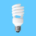White energy saving lightbulb isolated on blue background