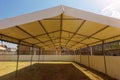 White entertainment tent in the garden in the sunlight Royalty Free Stock Photo