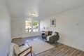 White entrance hall with comfortable tufted sofa