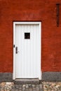 White Entry Door in Red Brick Building, Close Up, Exterior Royalty Free Stock Photo