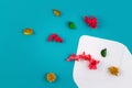 White envelop and colorful dried flowers, plants on blue background. Top view, flat lay Royalty Free Stock Photo