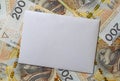 white envelope, blank note on money background, for finance and inflation Royalty Free Stock Photo